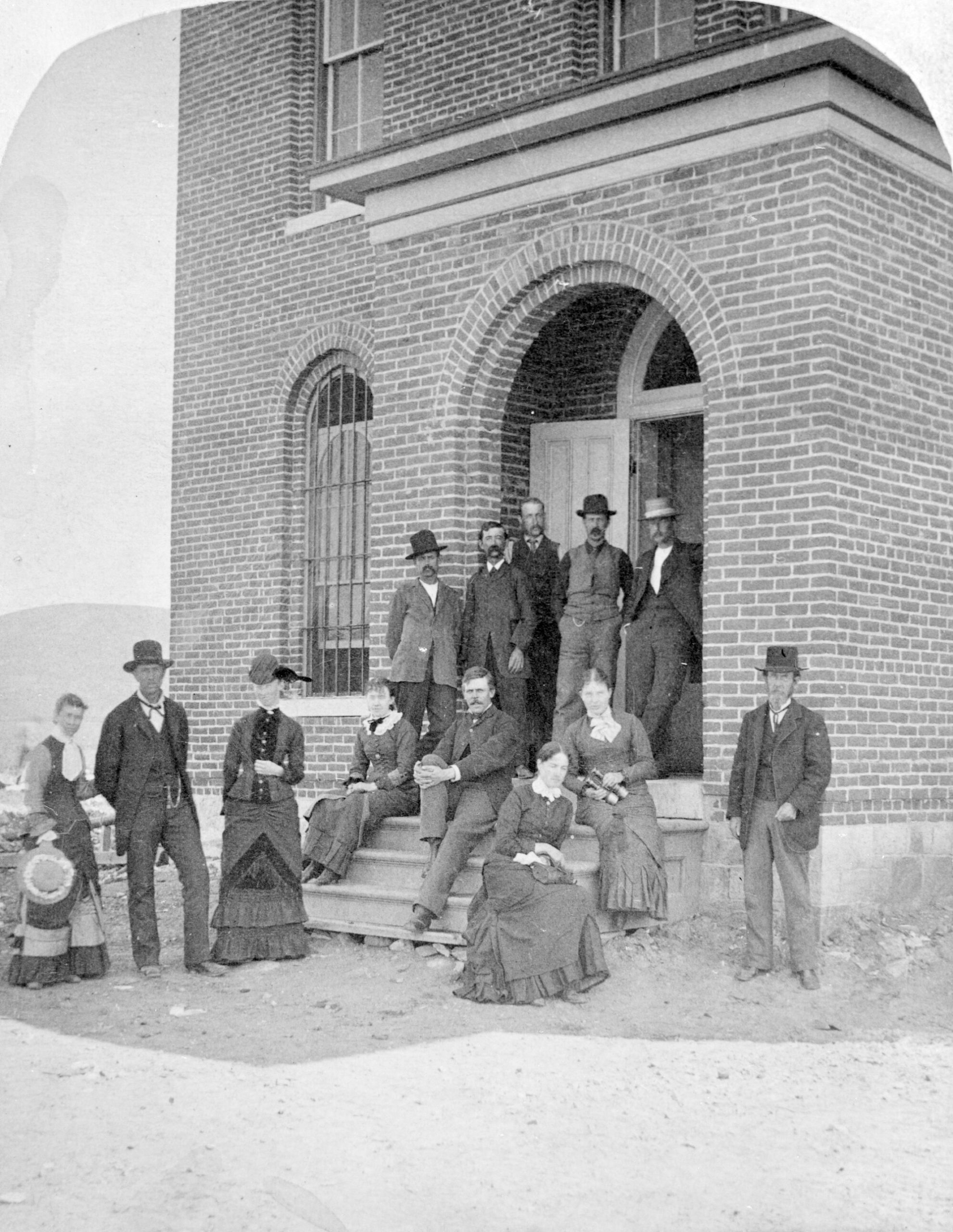 Annie and Alonzo with a group outside the Gunnison County Courthouse before marriage - 1881