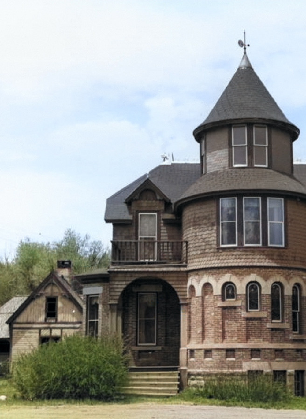 Colorized photo of the historic Hartman Castle in Gunnison, Colorado for Hartman Castle Preservation Corp. blog titled "The Social Power of Preservation and Placemaking"