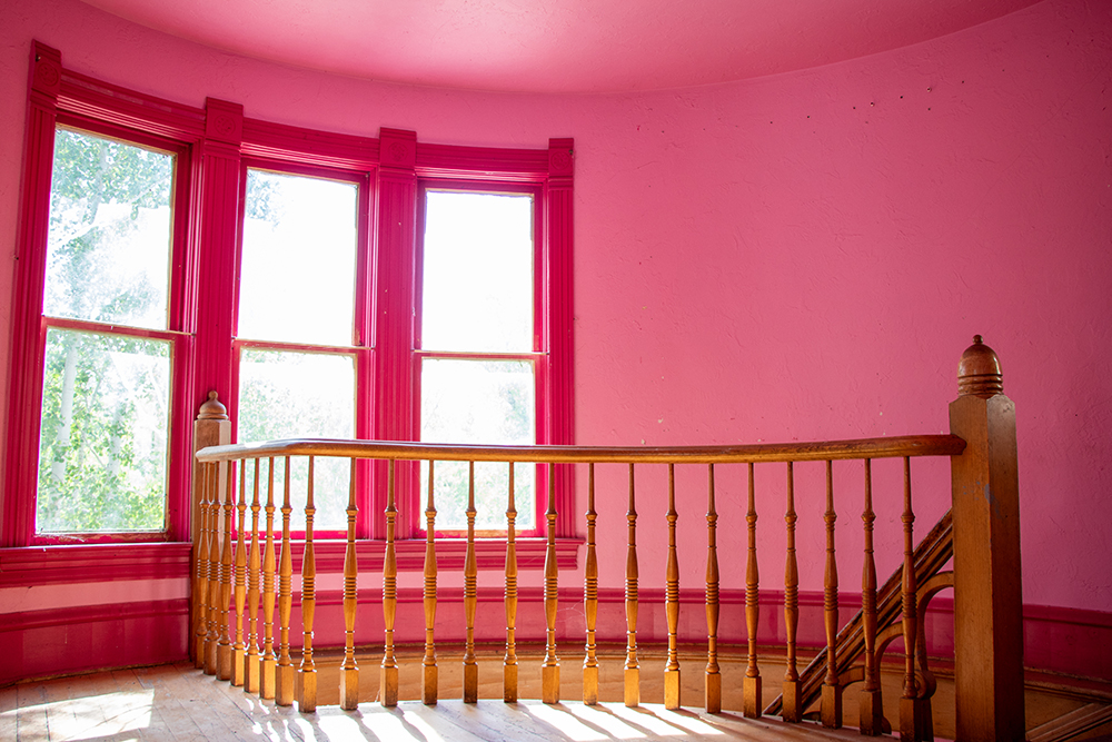 Preserving the Legacy of Colorado Cattle Country: The Castle Alonzo Hartman Built Brightly lit landing at the top of historic Hartman Castle's spiral staircase